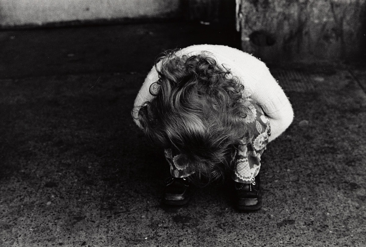 MARK COHEN (1943- ) Little girl hiding face.